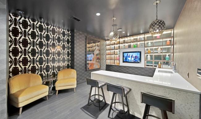 Find your perfect fit at Citizen a kitchen with a bar and chairs