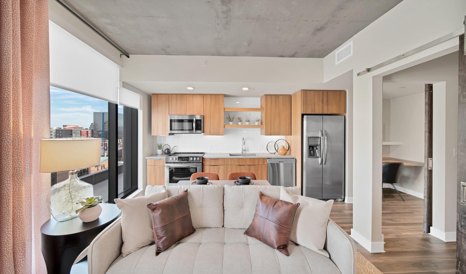 Wide open living areas flooded with natural light a living room with a couch and a table