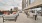 a rooftop patio with tables and chairs