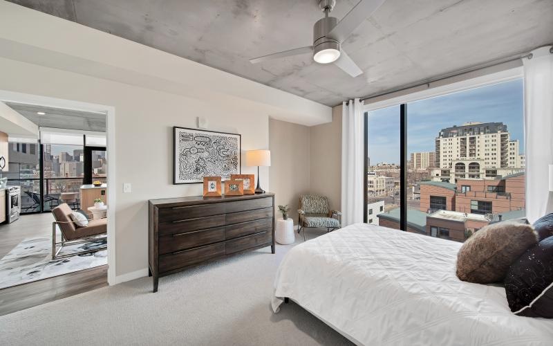 a bedroom with a large window