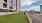 a building with a grass lawn