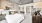 a bedroom with a mirror bed and lamps