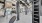 a gym with exercise equipment and a spiral staircase
