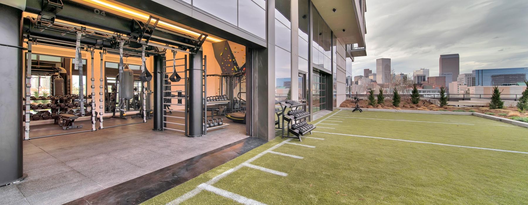 a practice field with a building in the background